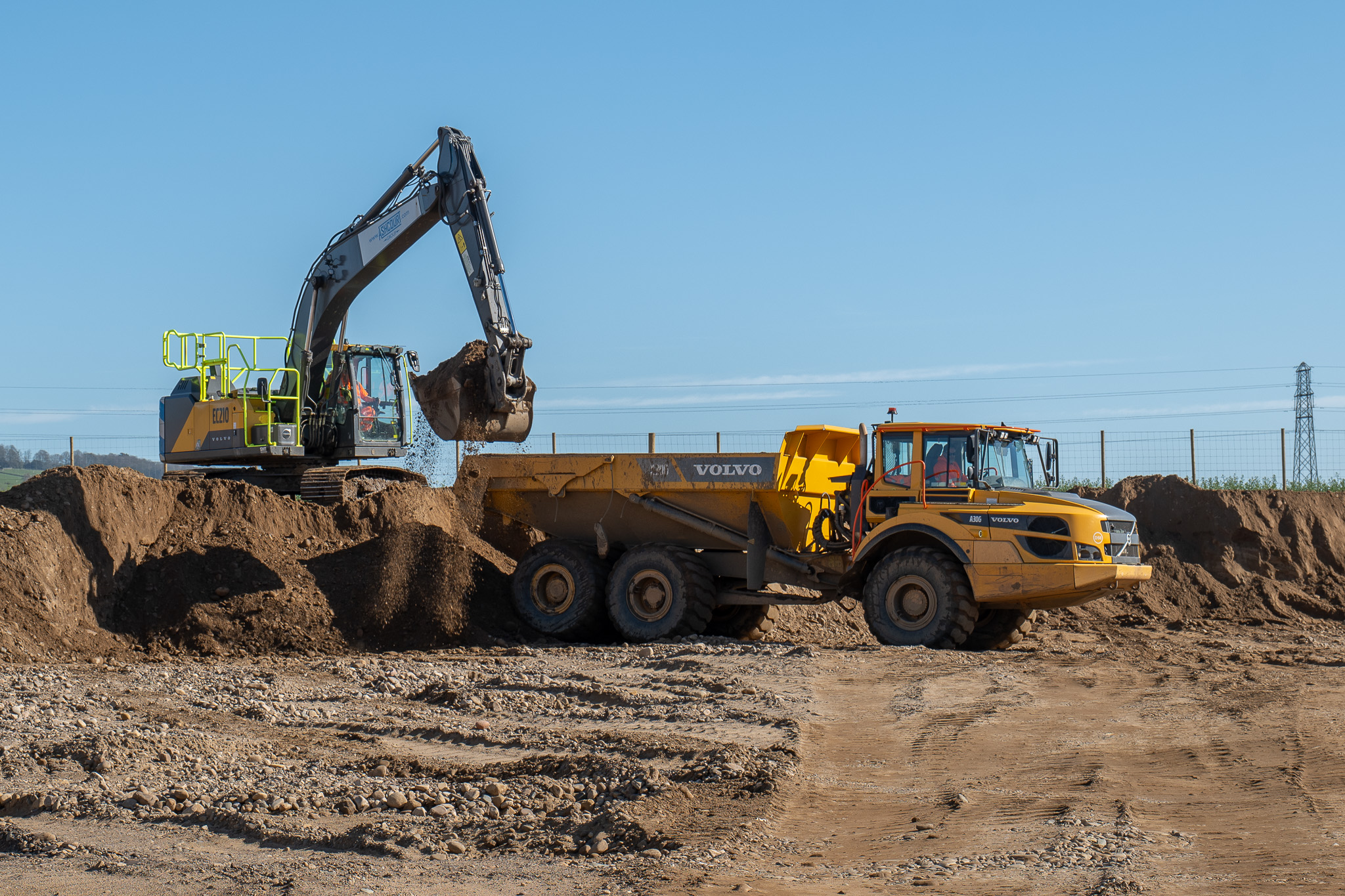 Excavator loading a dump truck at Anick Grange Quarry